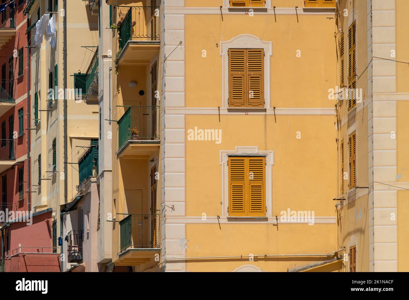 Shuttered windows and colorful residential buildings in the seaside town of Camogli, Italy. . Stock Photo