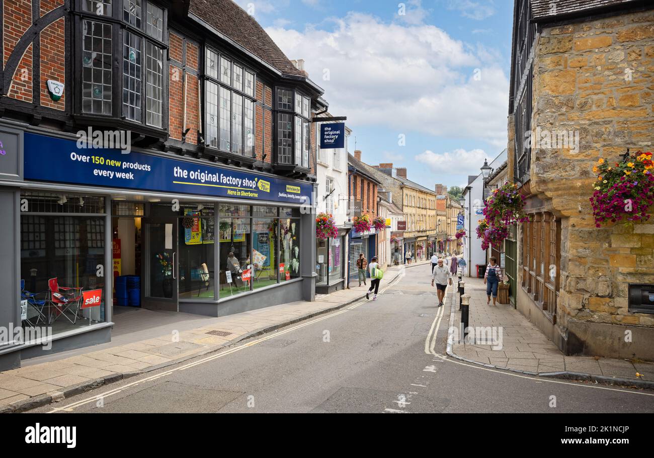 Retail shops on Main Street, Sherborne, Dorset, UK on 28 August 2022