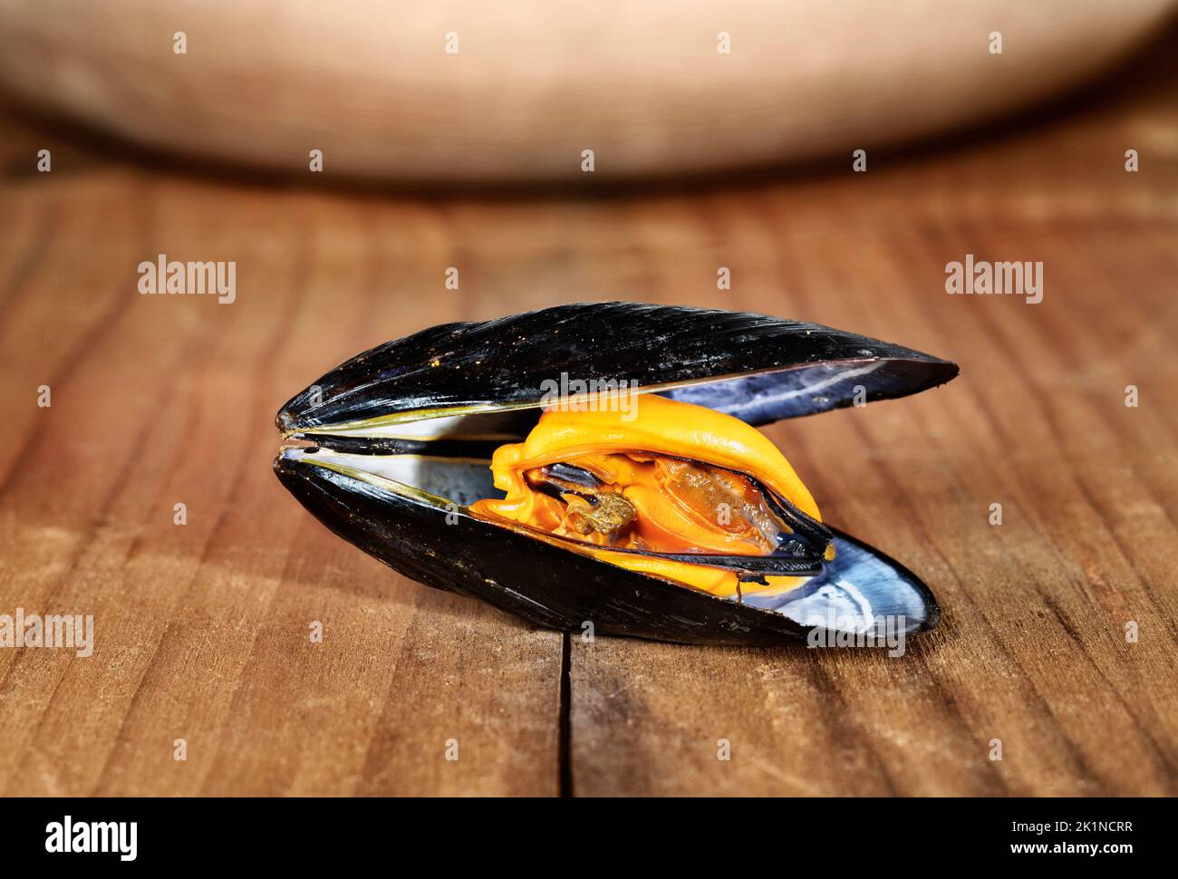 Opened mussel fish on wooden table ,  healthy eating food Stock Photo