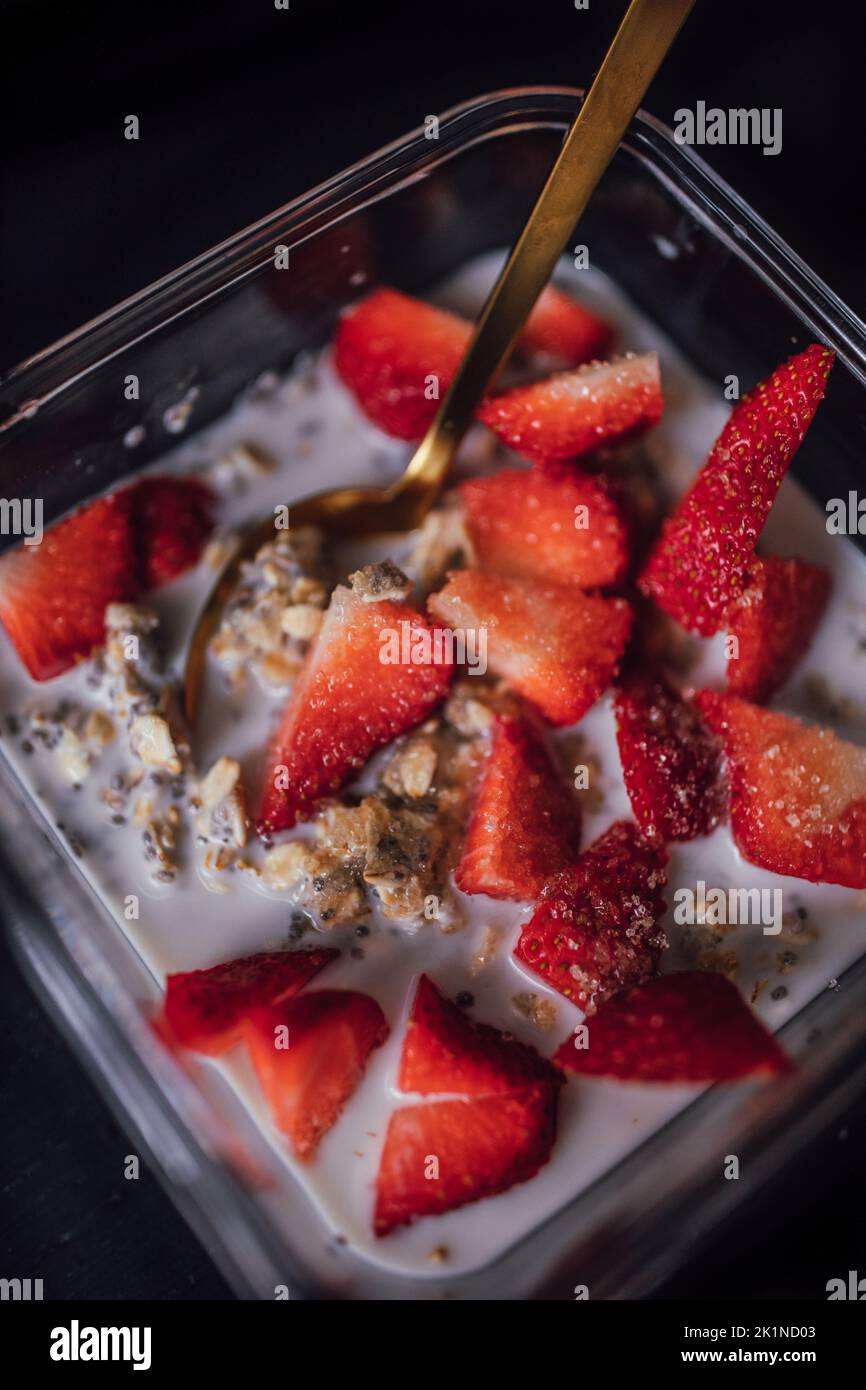 overnight oats with chia, strawberries, and sugar granules Stock Photo