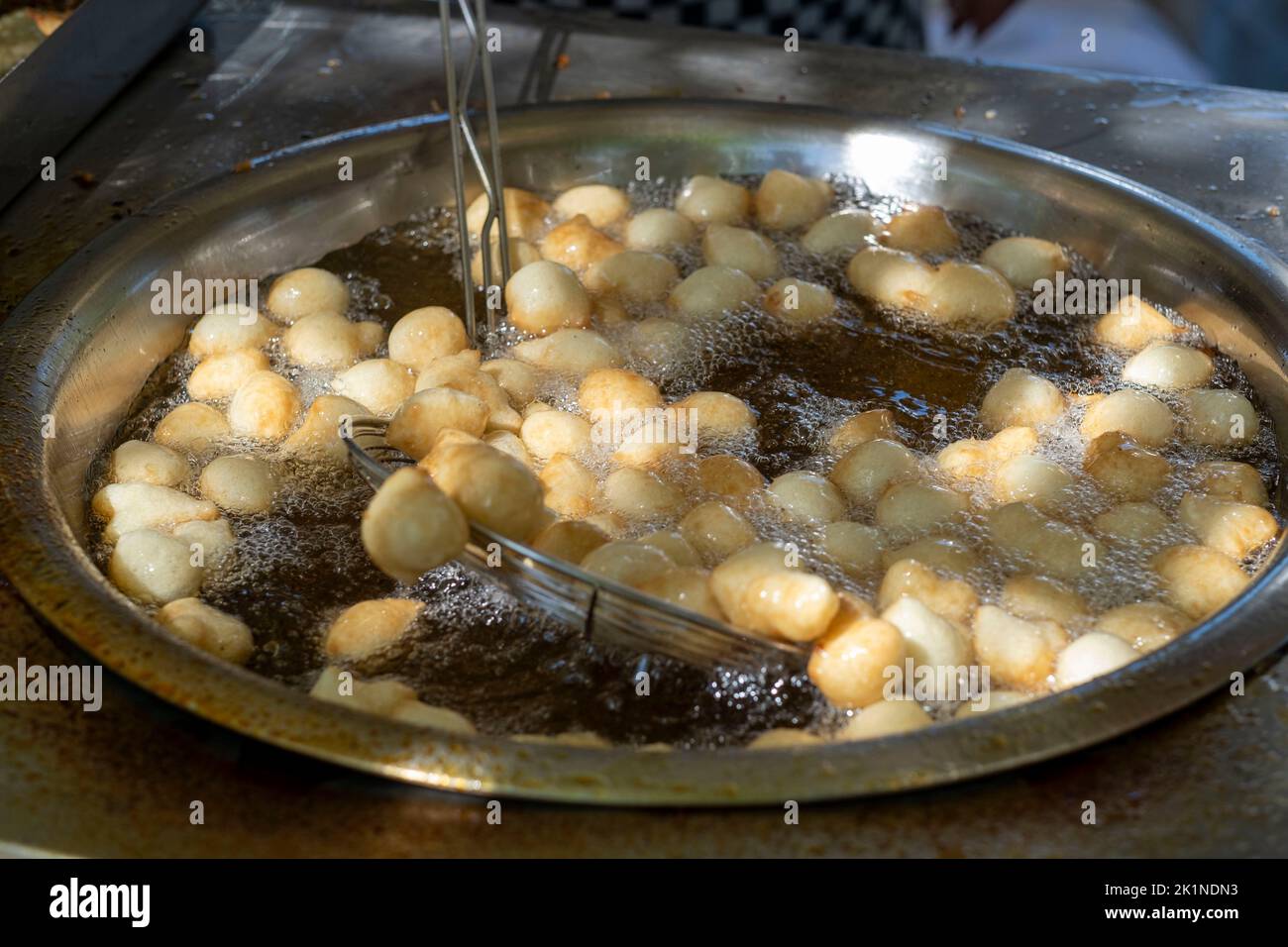 Loukoumades (Cypriot doughnuts) being made at the Statos-Agios Fotios Rural Festival, Paphos region, Cyprus Stock Photo