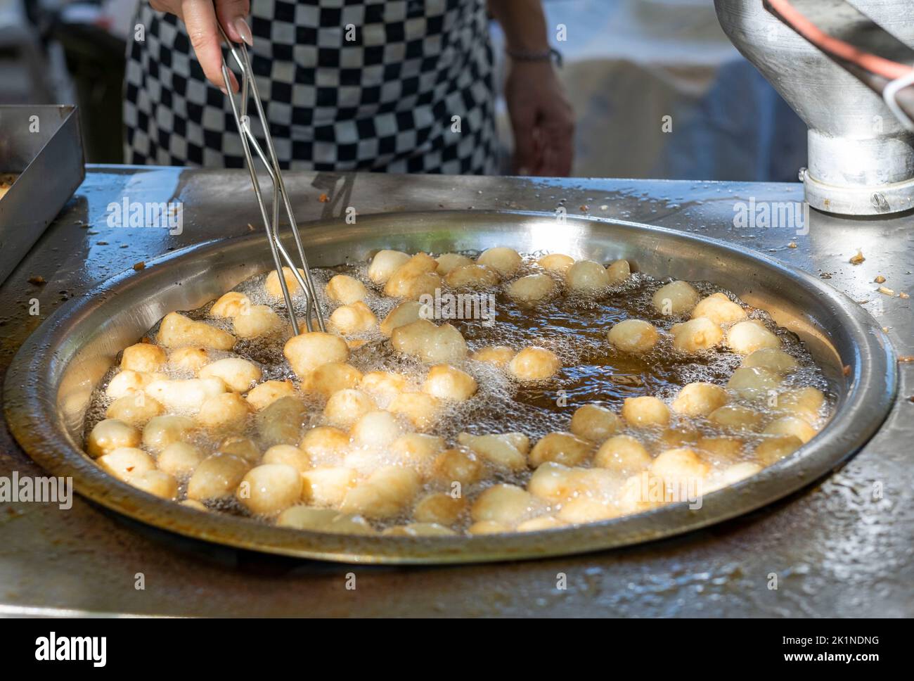 Loukoumades (Cypriot doughnuts) being made at the Statos-Agios Fotios Rural Festival, Paphos region, Cyprus Stock Photo