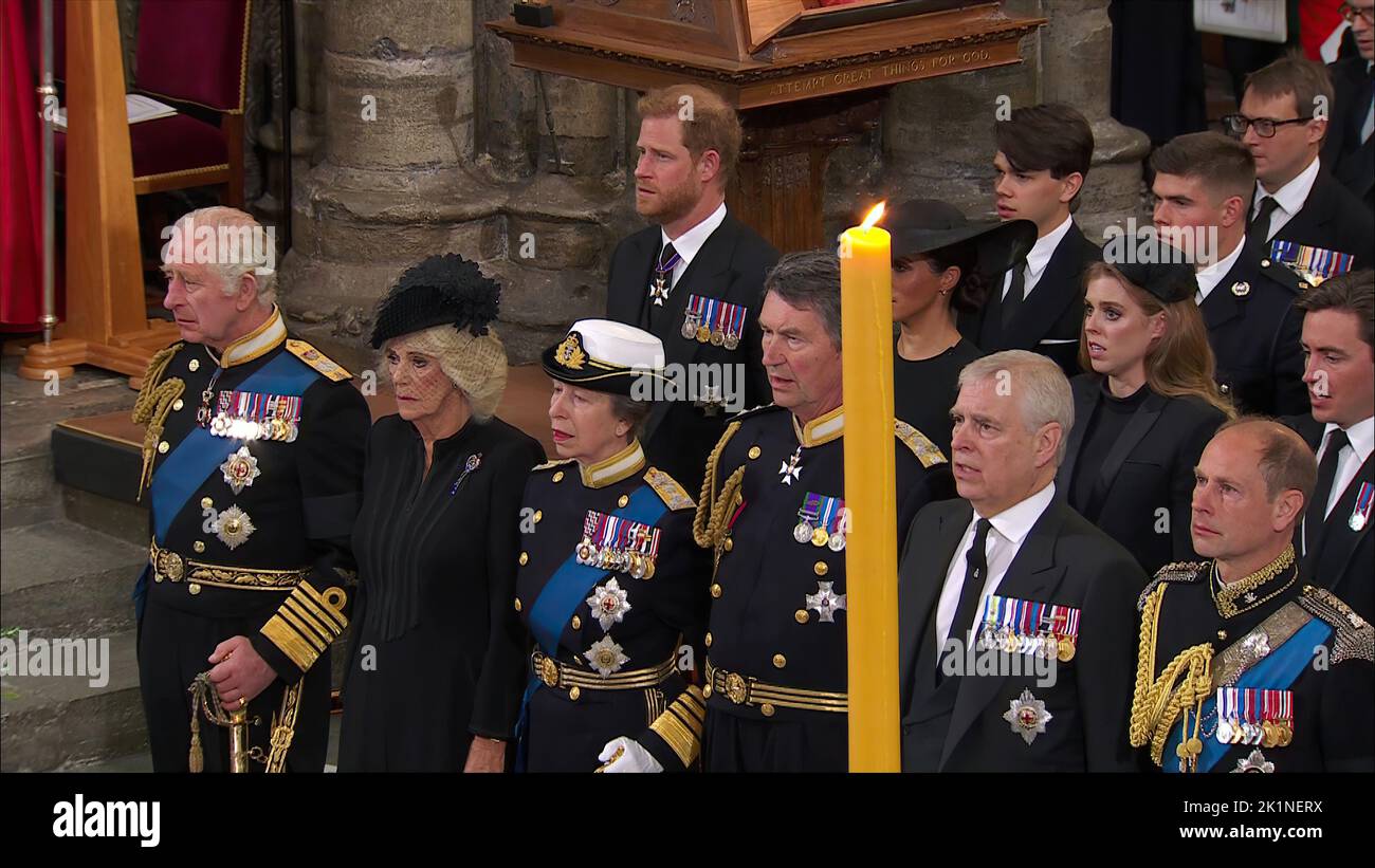 Queen’s State Funeral 19.9.22Westminster Abbey  Meghan behind a candle as  Tears of the Crown King Charles tear in his eye as the National Anthem is s Stock Photo