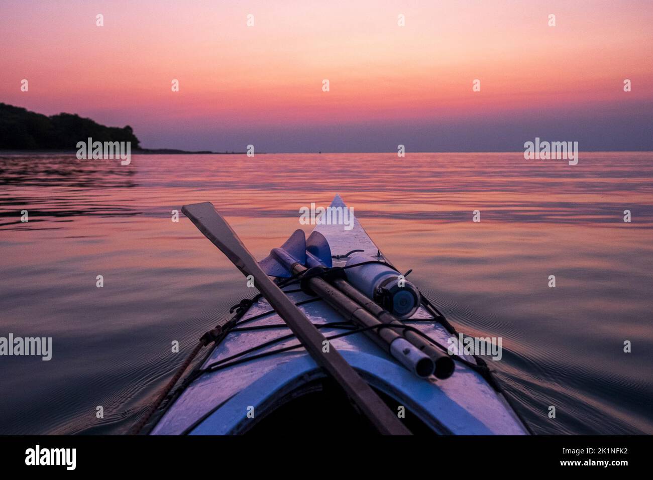 Wooden sea kayak at sunset off Sleeping Bear Dunes, Lake Michigan, USA Stock Photo