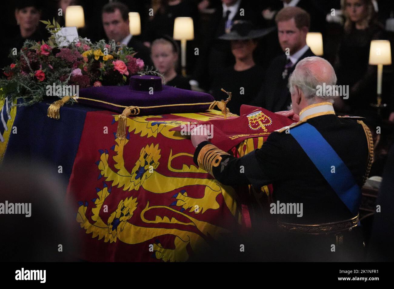 King Charles III places the the Queen's Company Camp Colour of the Grenadier Guards on the coffin during the Committal Service for Queen Elizabeth II held at St George's Chapel in Windsor Castle, Berkshire. Picture date: Monday September 19, 2022. Stock Photo