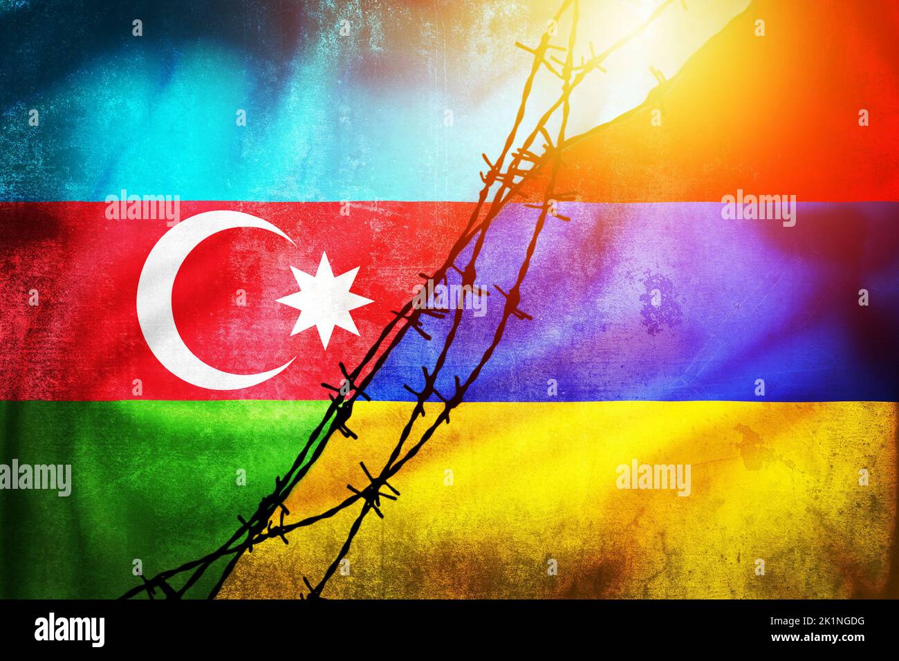 Grunge flags of Azerbaijan and Armenia divided by barb wire illustration sun haze view, concept of tense relations between two countries Stock Photo