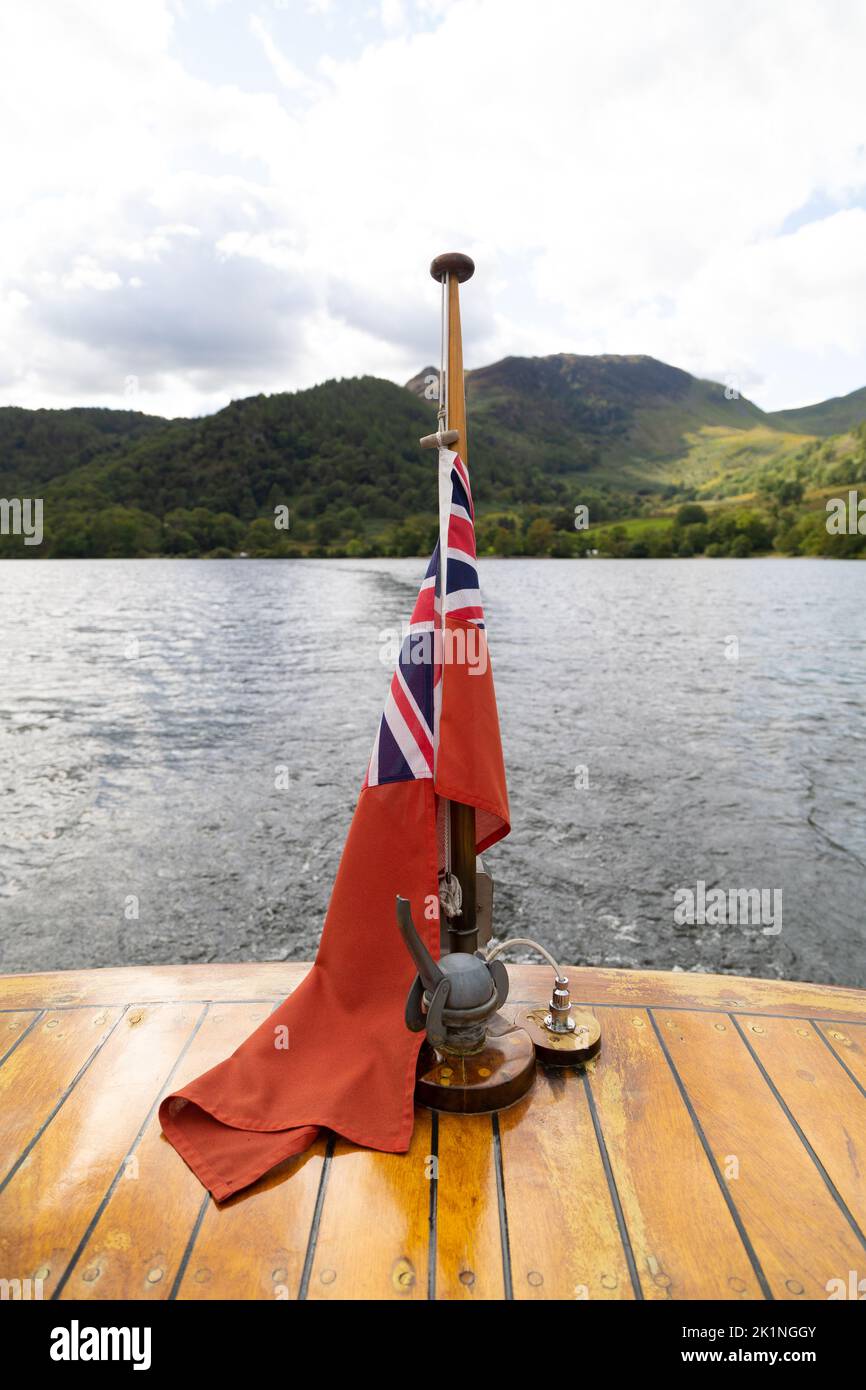 Union Jack Ensign on the back of a boat.This is a red flag with the Union Jack in the canton. Stock Photo