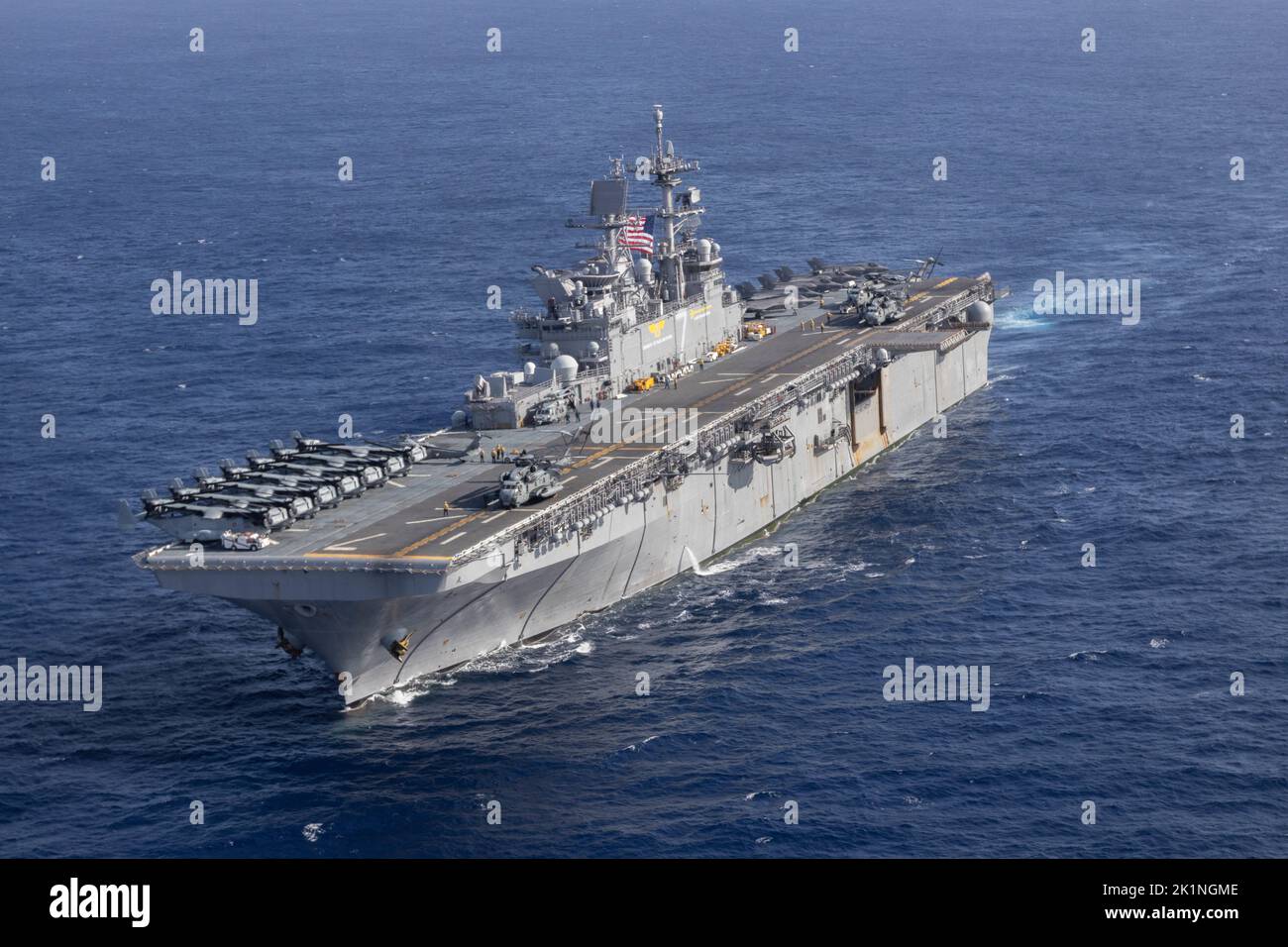 Philippine Sea, United States. 17 September, 2022. The U.S. Navy America-class amphibious assault ship USS Tripoli during a training mission with the USS America, September 17, 2022 in the Philippine Sea. Credit: LCpl. Christopher Lape/U.S. Marines Photo/Alamy Live News Stock Photo