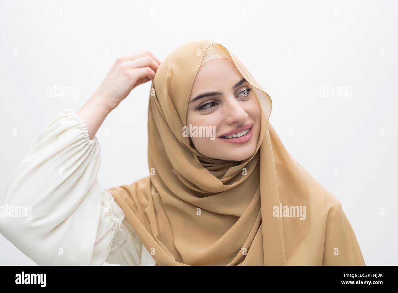 Portrait of young muslim woman wearing hijab on isolated white ...