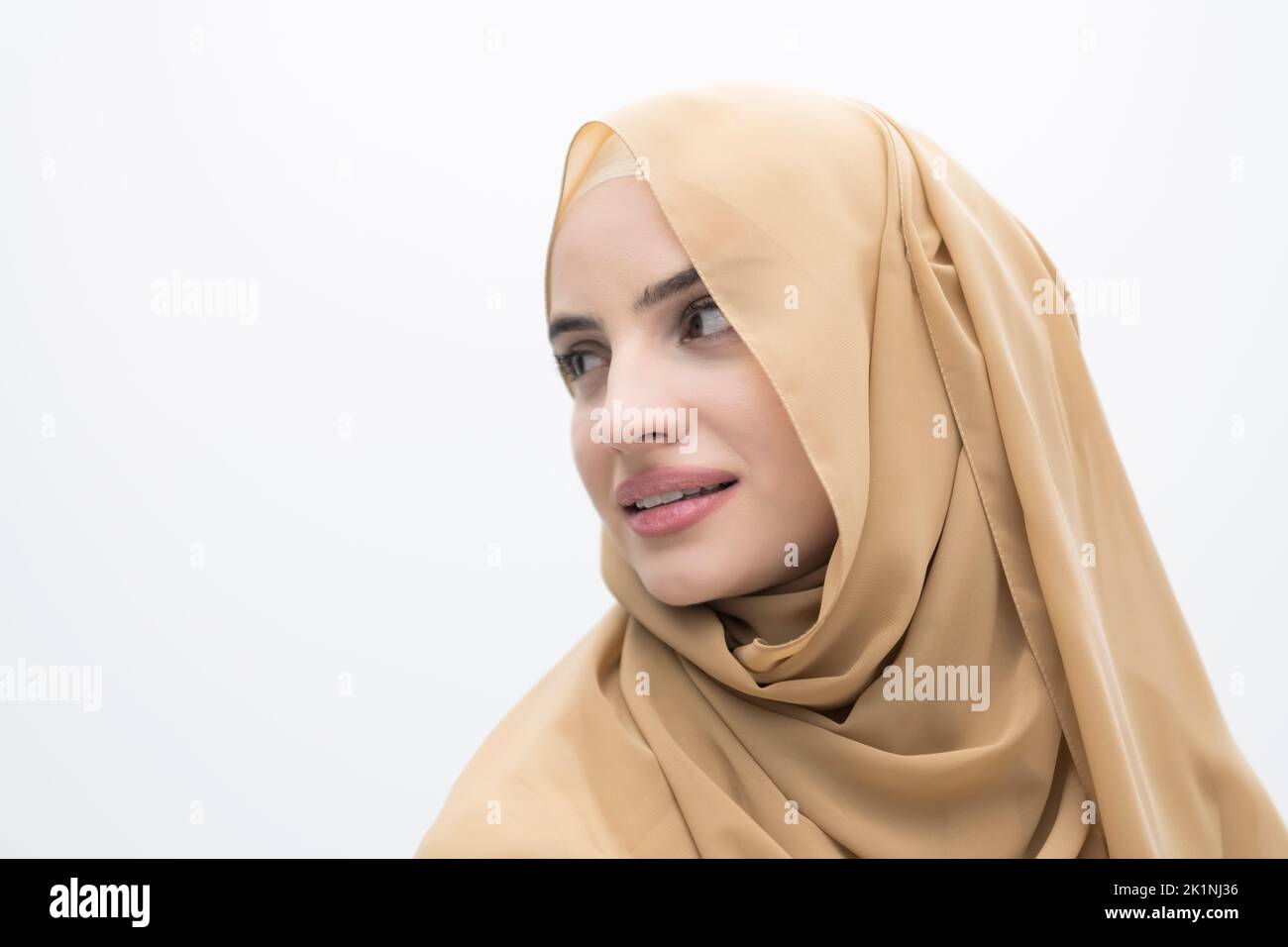 Portrait of young muslim woman wearing hijab on isolated white ...