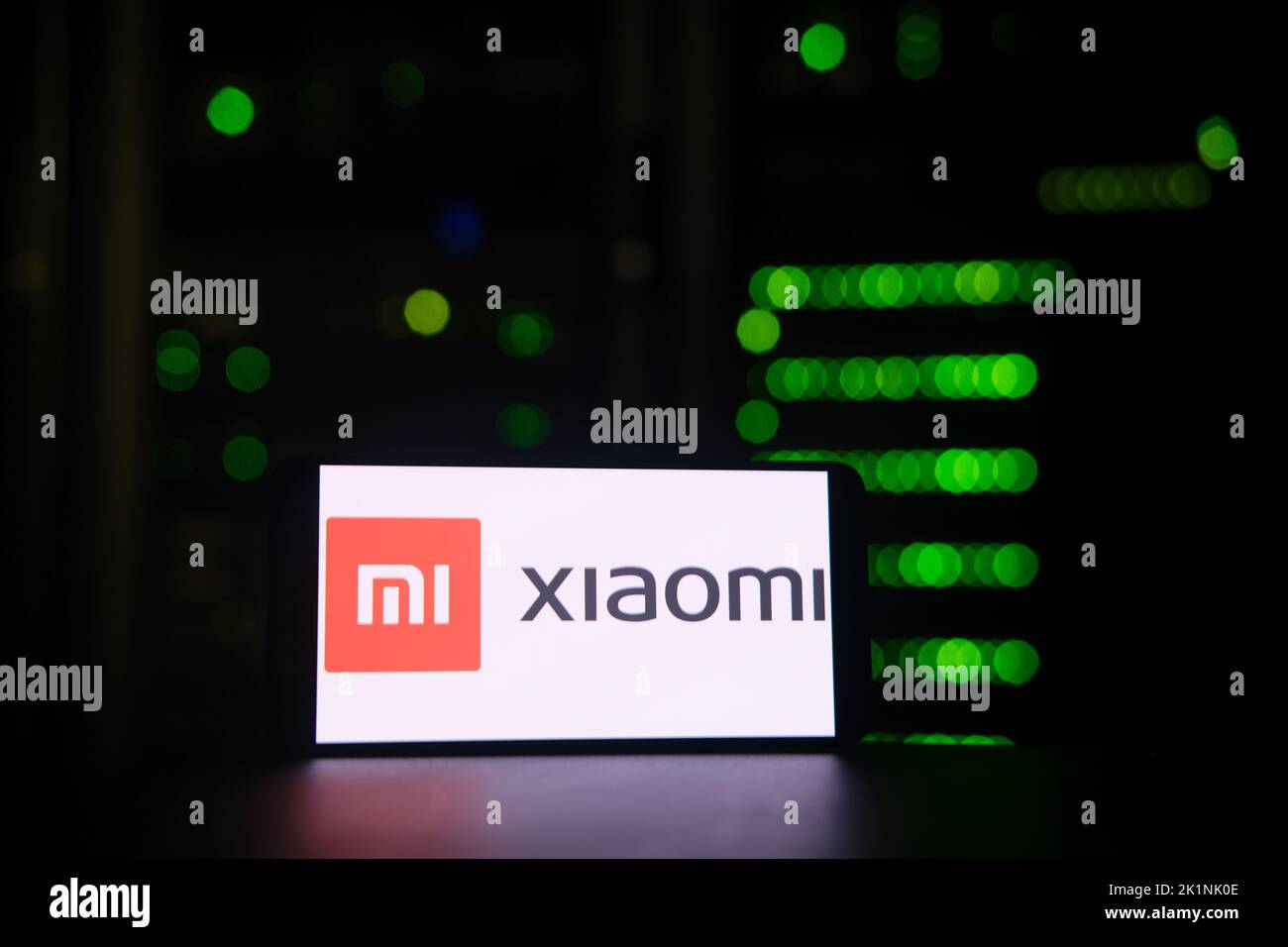 Xiaomi Mi company logo on the background of a bokeh server light - Moscow, Russia, August 27, 2022 Stock Photo