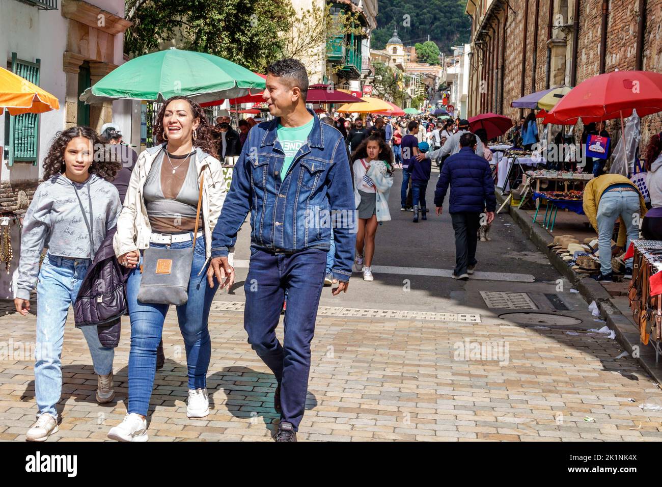 Bogota Colombia,La Candelaria Centro Historico central historic old city center centre Calle 11,busy street pedestrians family holding hands walking f Stock Photo
