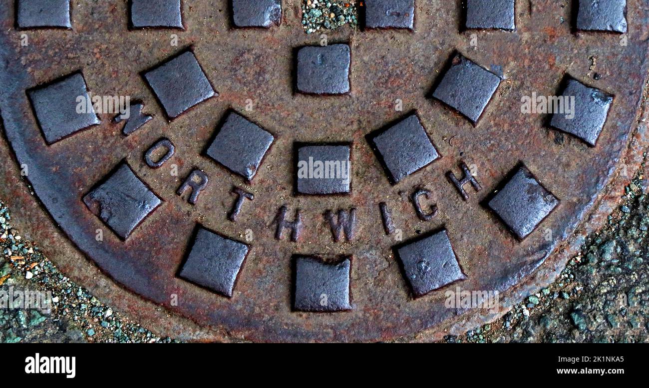 Embossed cast iron grid, grate, drain cover - Northwich, Cheshire, England, UK, CW8 1AD Stock Photo