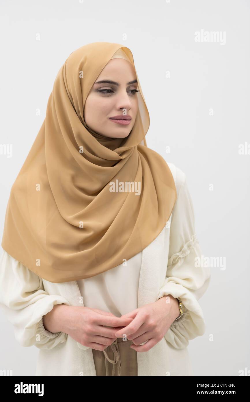 Portrait of young muslim woman wearing hijab on isolated white ...