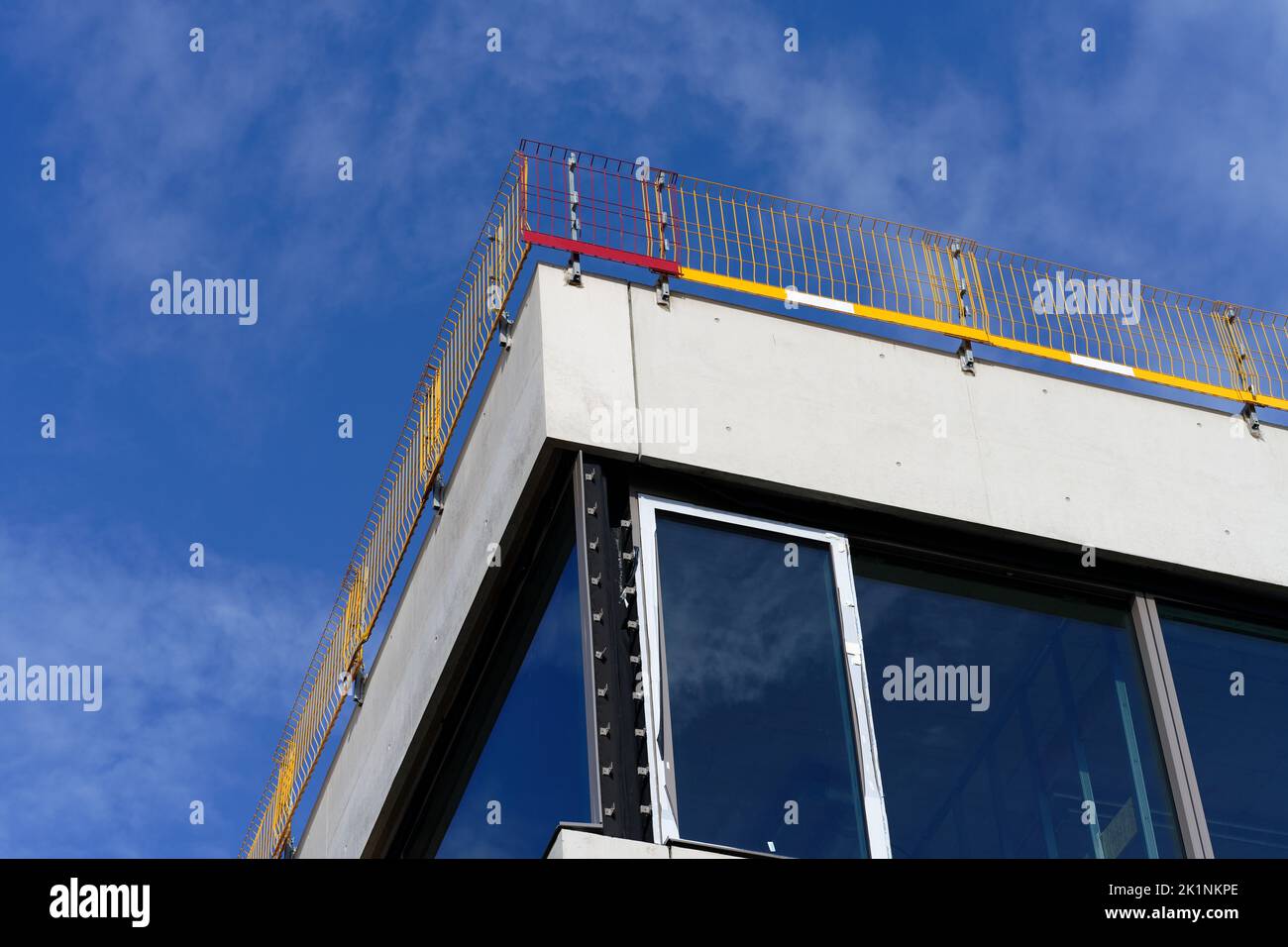 fall protection on the flat roof of a shell of a school building Stock