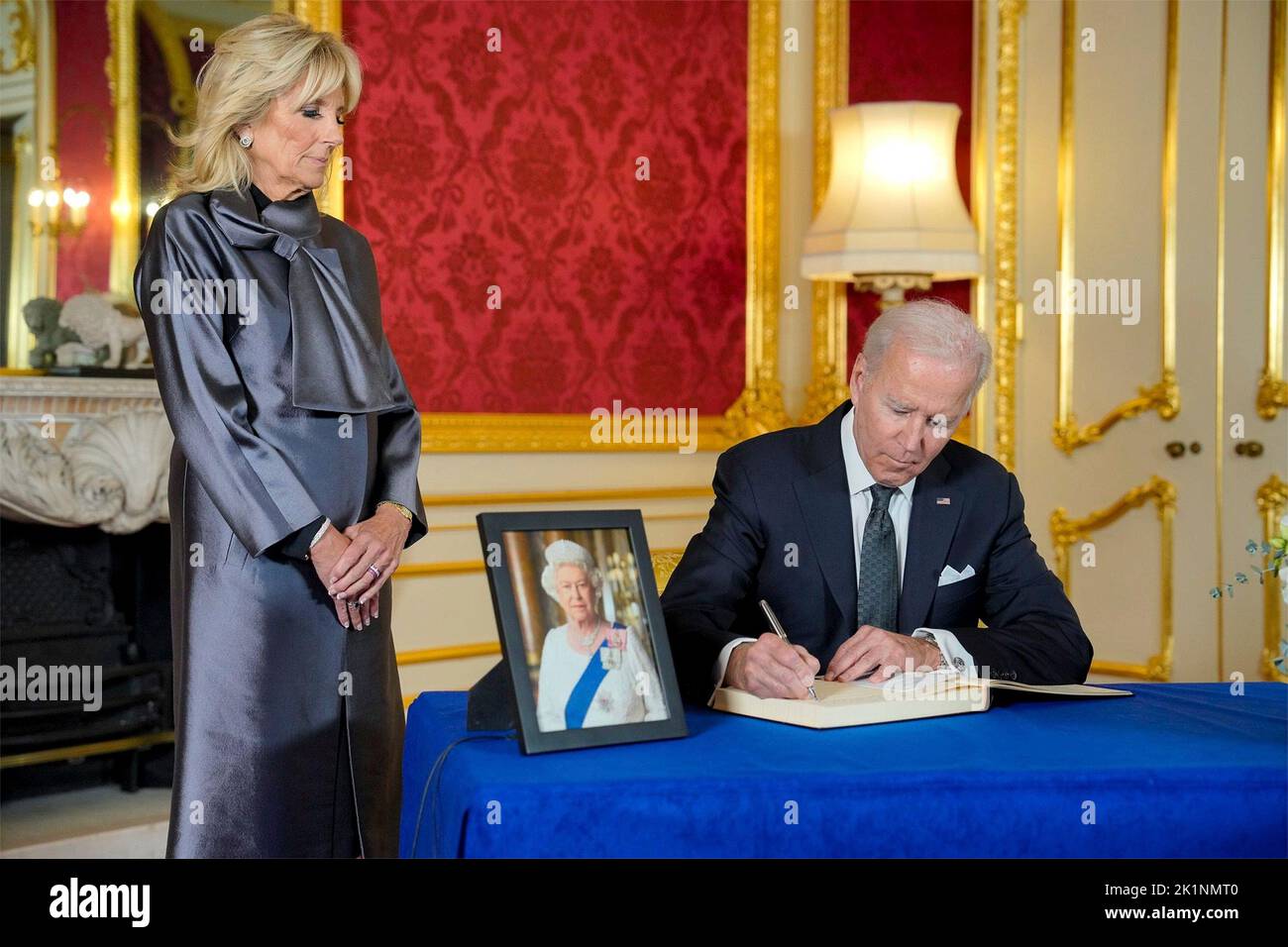 London, United Kingdom. 18th Sep, 2022. U.S. President Joe Biden signs the book of condolences on the death of Queen Elizabeth II, as First Lady Jill Biden looks on at Lancaster House, September 18, 2022, in London, United Kingdom. Credit: Adam Schultz/White House Photo/Alamy Live News Stock Photo