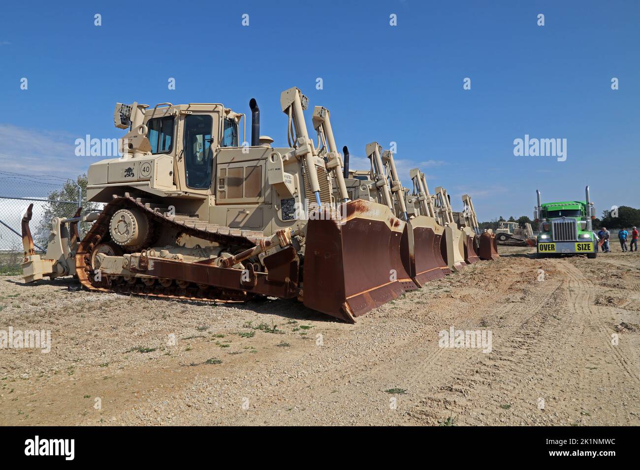 Seven D7RII Dozers which belong to the  317th Engineer Company, 327th Engineer Company and 996th Engineer Company, 372nd Engineer Brigade, 416th Theater Engineer Command, are parked at the 88th Readiness Division-operated draw yard on Fort McCoy, Wis., Sept. 16, 2022. Sixteen dozers were stored at Fort Bliss, Texas, after the brigade’s deployments. There will be more equipment belonging to the brigade arriving at the fort in this Army Reset plan. (U.S. Army Reserve photo by Sgt. 1st Class Clinton Wood, 88th Readiness Division). Stock Photo