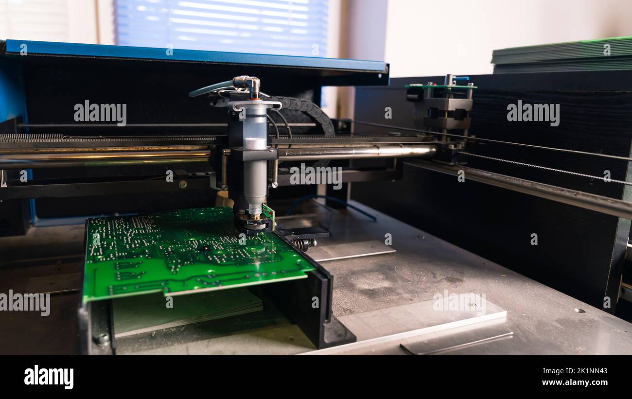 Soldering paste dispenser machine working on surface of PCB printed
