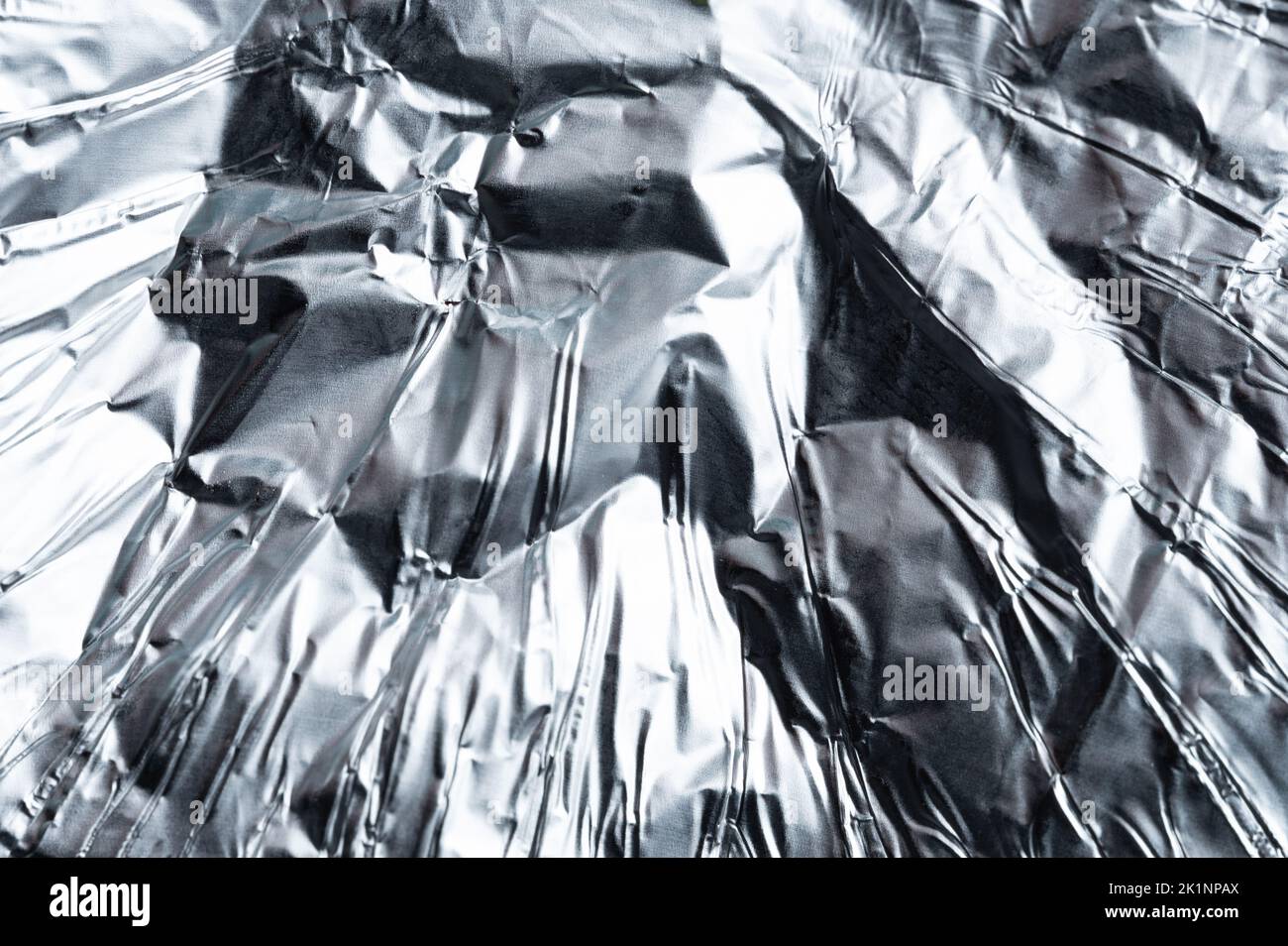 Polished crumpled metal foil macro close up view Stock Photo