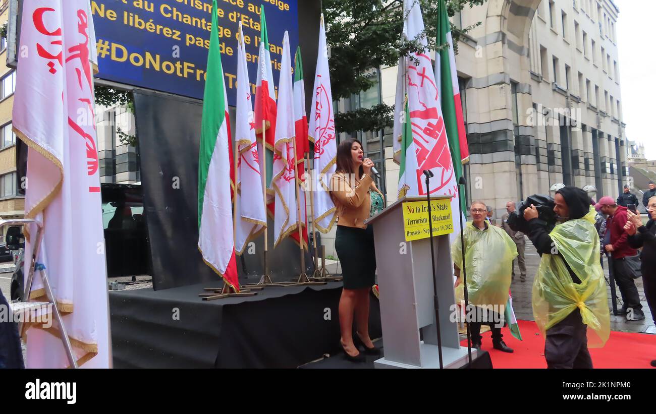 Manel Mslami, President of MR Women in Brussels speaks during the demonstration. Iranians took part in a rally in front of the Belgium Foreign Ministry in Brussels while carrying photos of Maryam Rajavi, the Iranian opposition leader. Iranians urged the government to cancel the agreement that sets the stage for the return of Assadollah Assadi, an Iranian diplomat to Iran. Assadi was condemned to 20 years in prison by a Belgium court for masterminding a plot to bomb a major international gathering in Paris of the Iranian opposition and is currently in jail in Belgium. Stock Photo