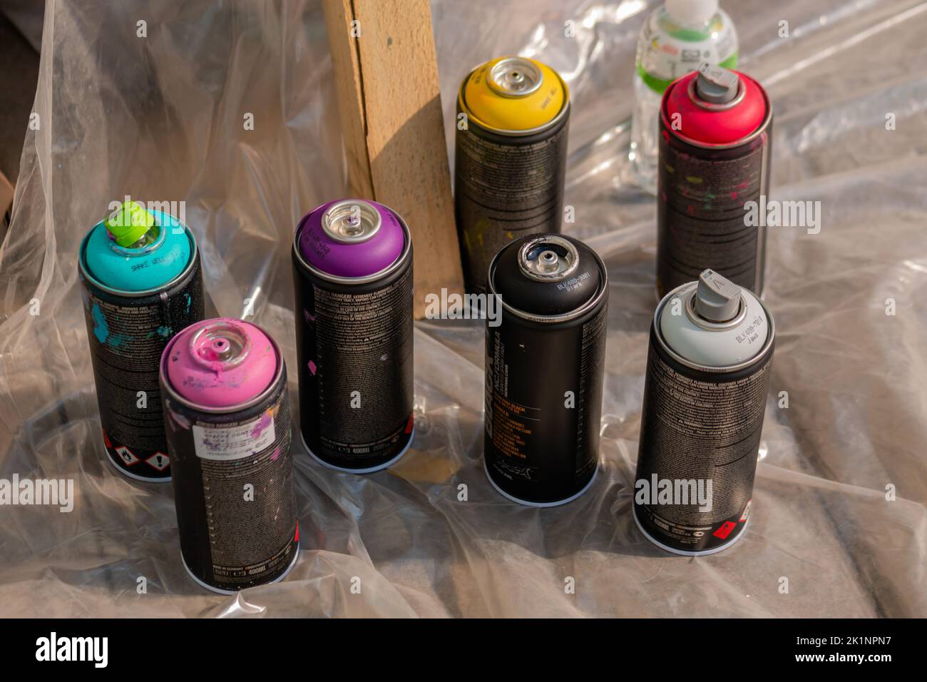Set of used spray paint cans at summer graffiti festival Stock Photo