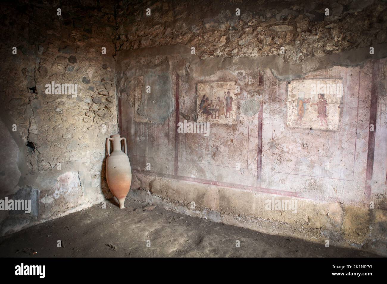frescos and an amphora in a room in Pompeii, Italy Stock Photo