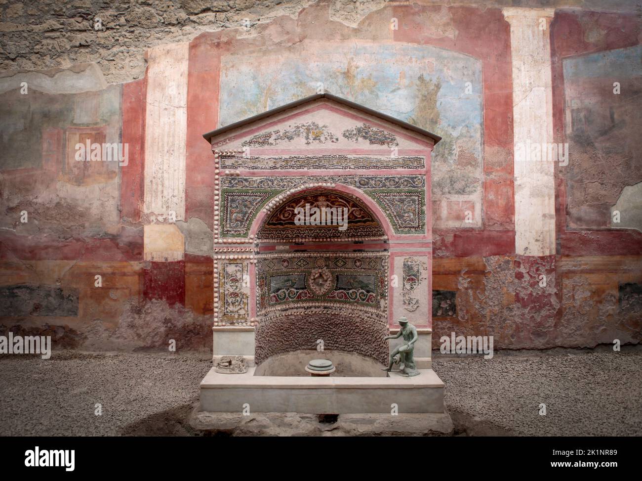 frescos and an shrine in a room in Pompeii, Italy Stock Photo