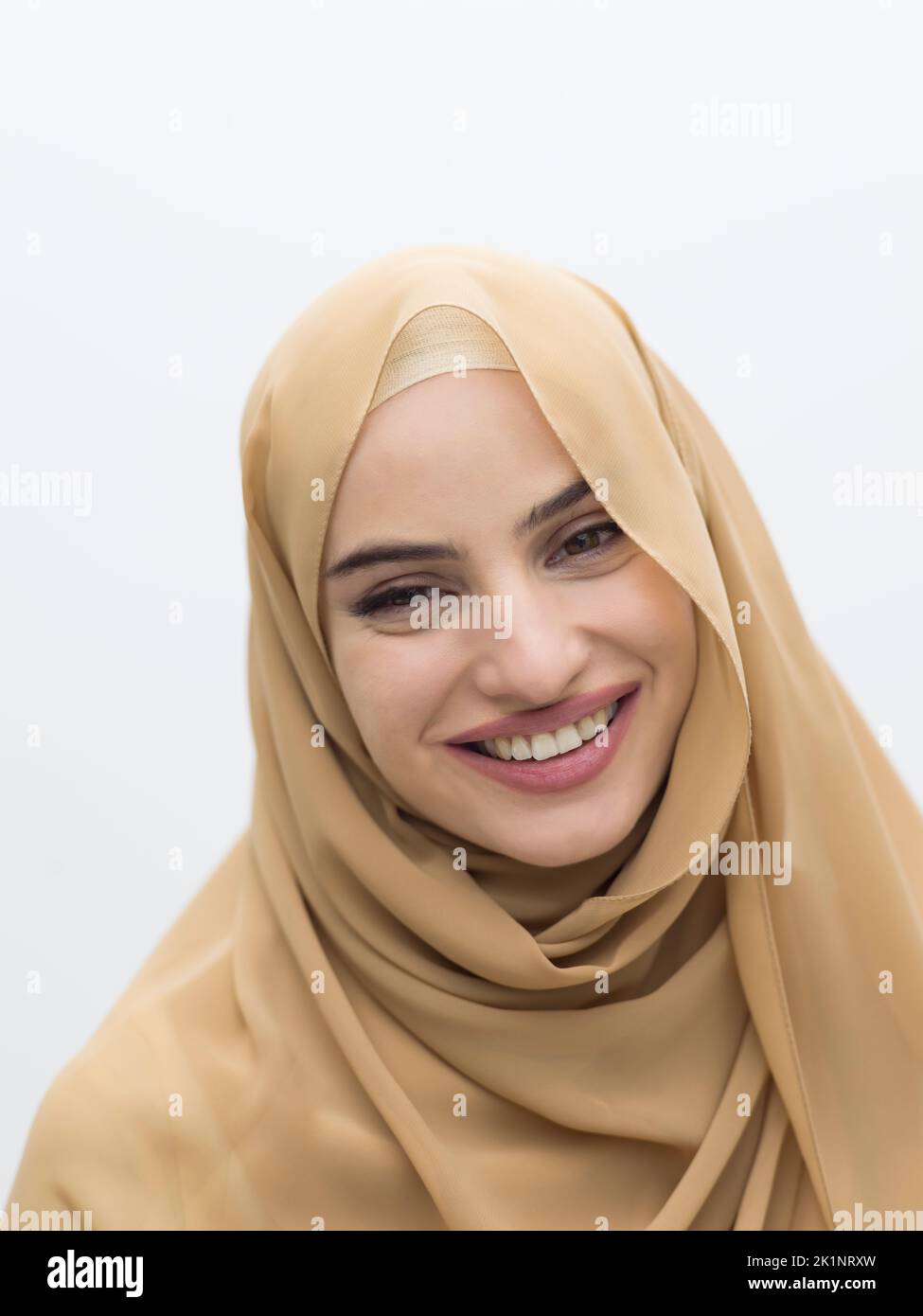 Portrait of young muslim woman wearing hijab on isolated white ...