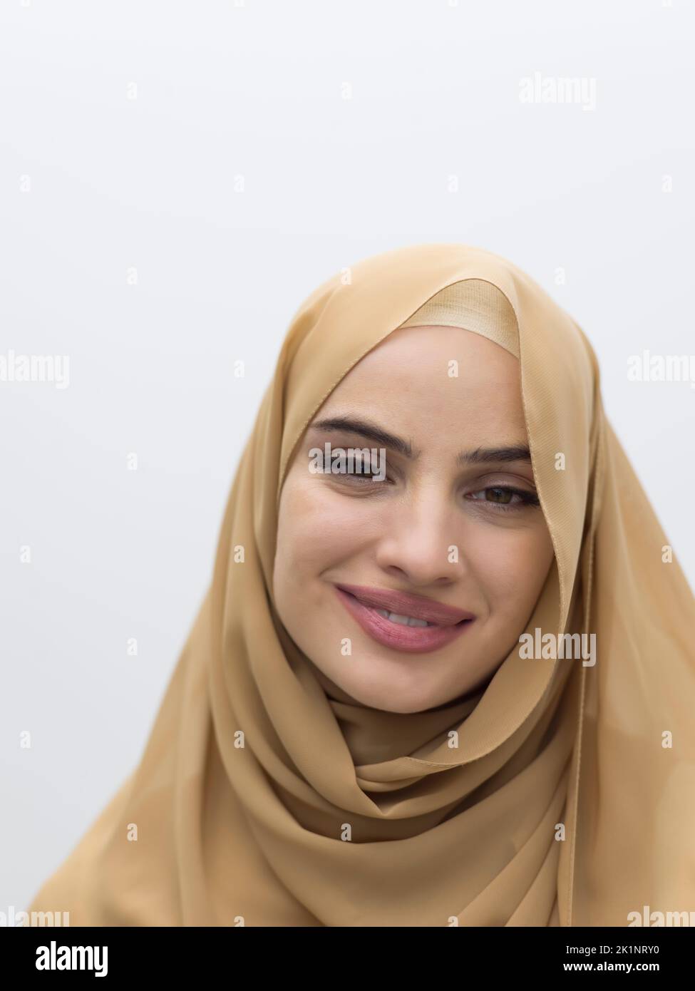 Portrait of young muslim woman wearing hijab on isolated white ...
