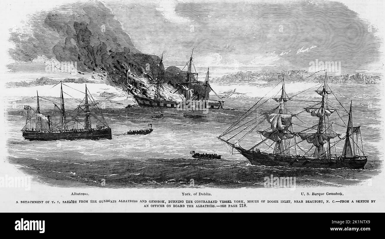 A detachment of U. S. sailors from the gunboats Albatross and Gemsbok, burning the contraband vessel York, mouth of Bogue Inlet, near Beaufort, North Carolina. January 1862. 19th century American Civil War illustration from Frank Leslie's Illustrated Newspaper Stock Photo