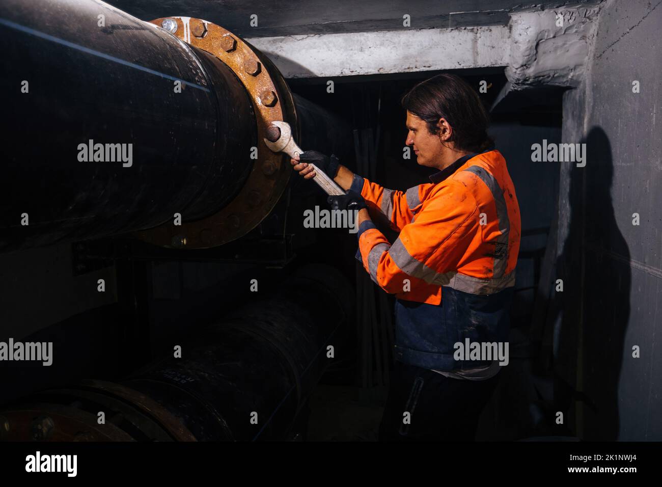 Workers installing water supply pipeline system, close up. Stock Photo