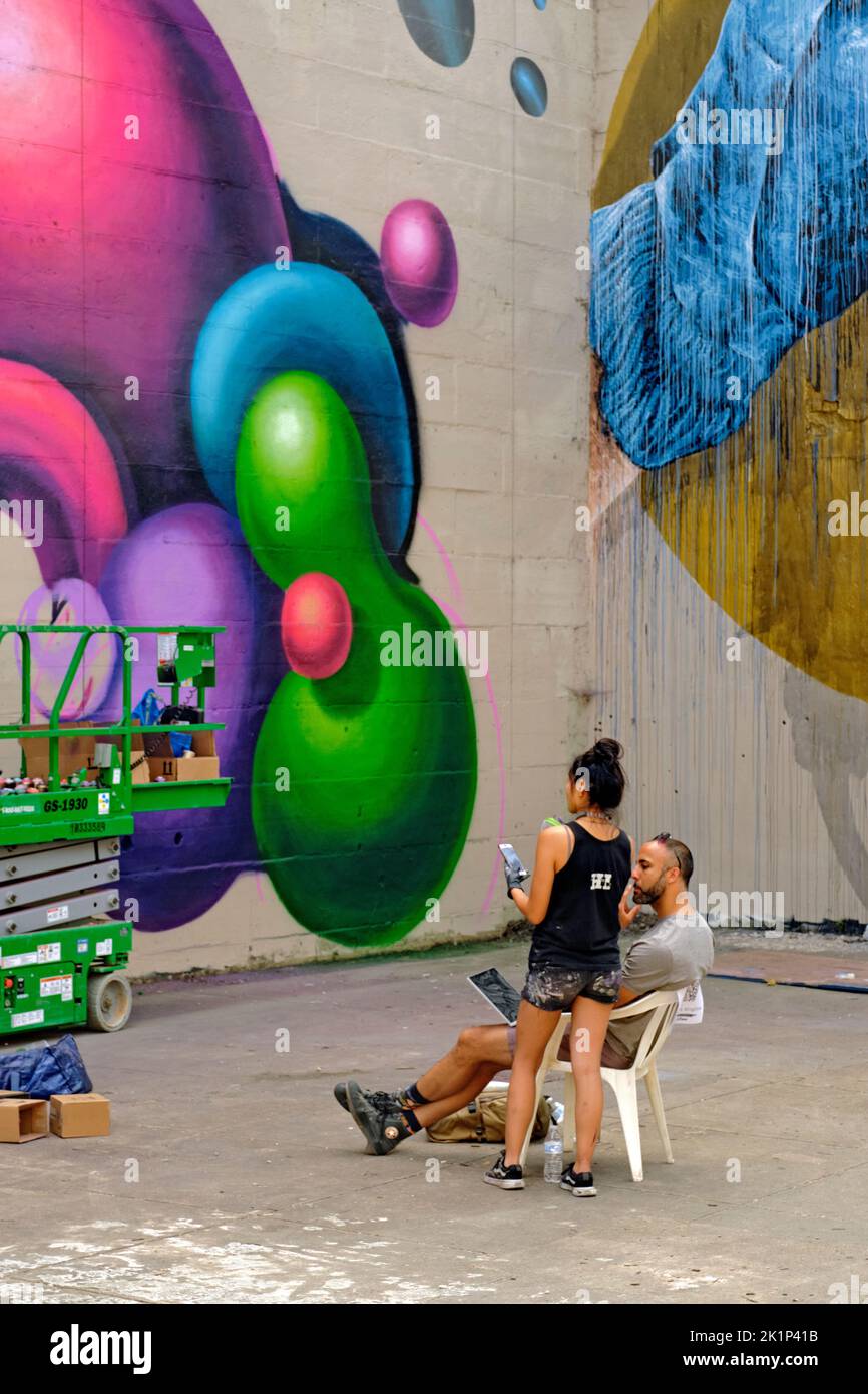 Artist Wing Chow creates a new mural during the 2022 RVA Street Art