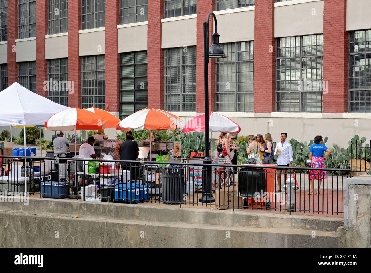 Visitors purchase food and refreshment along Richmond, Virginia's Haxall Canal Walk in the downtown area. Stock Photo