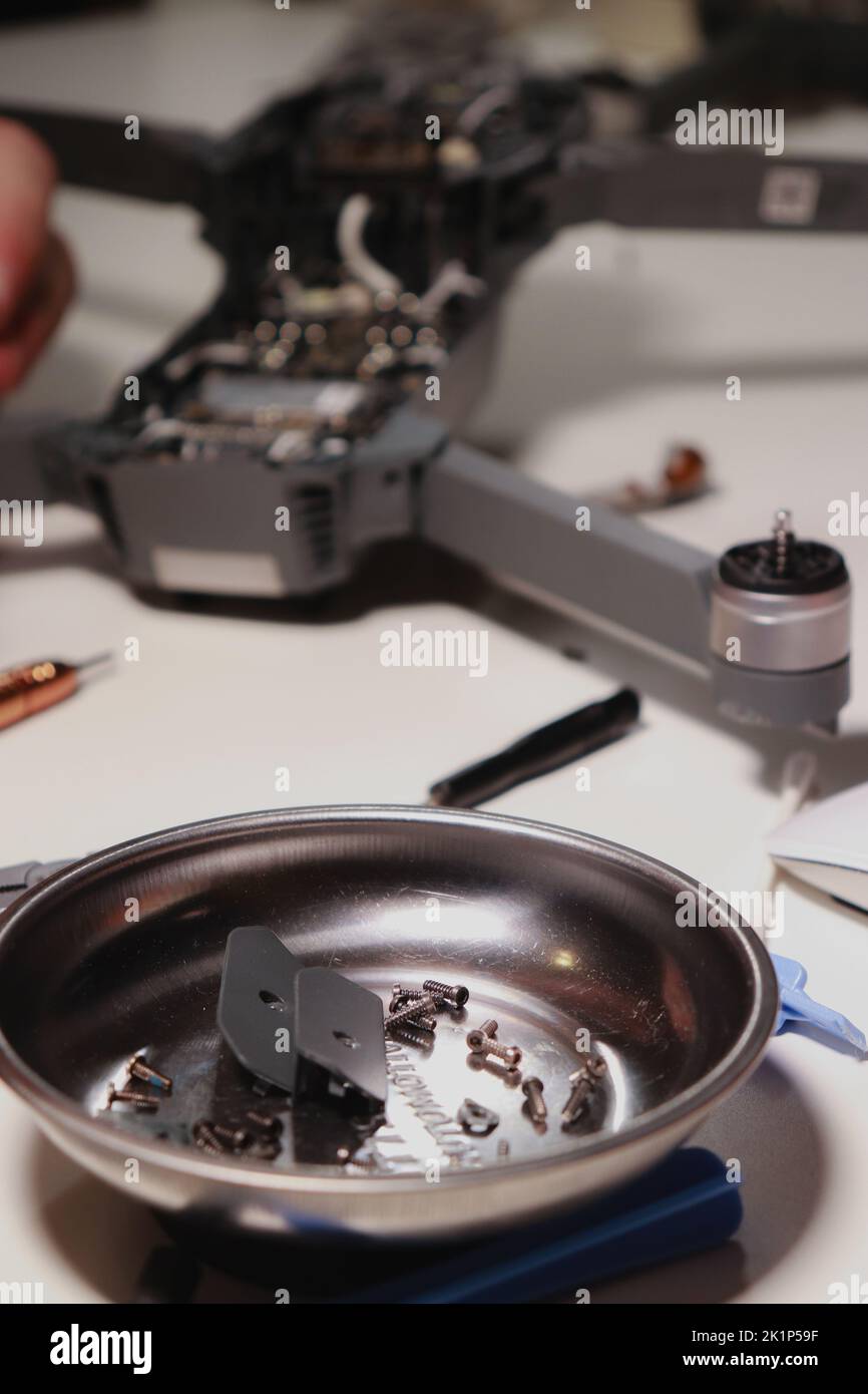close up of different repairing tools and a drone, on white table Stock Photo