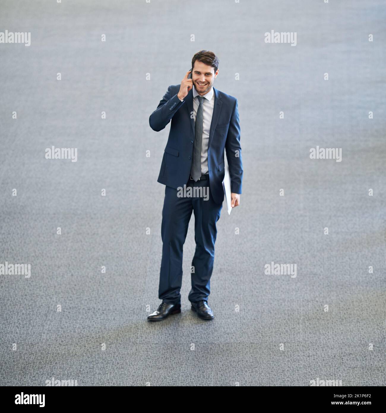 Taking success in his stride. Full length shot of a young businessman ...