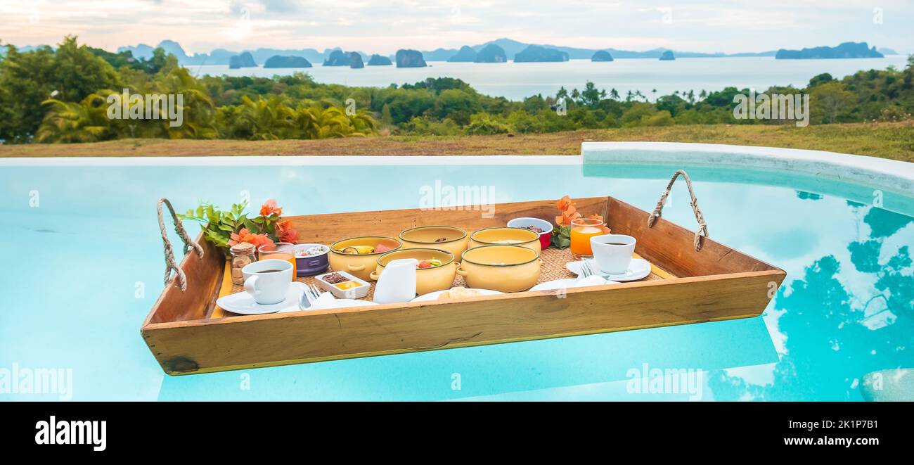 Floating Breakfast tray in swimming pool at luxury hotel or tropical