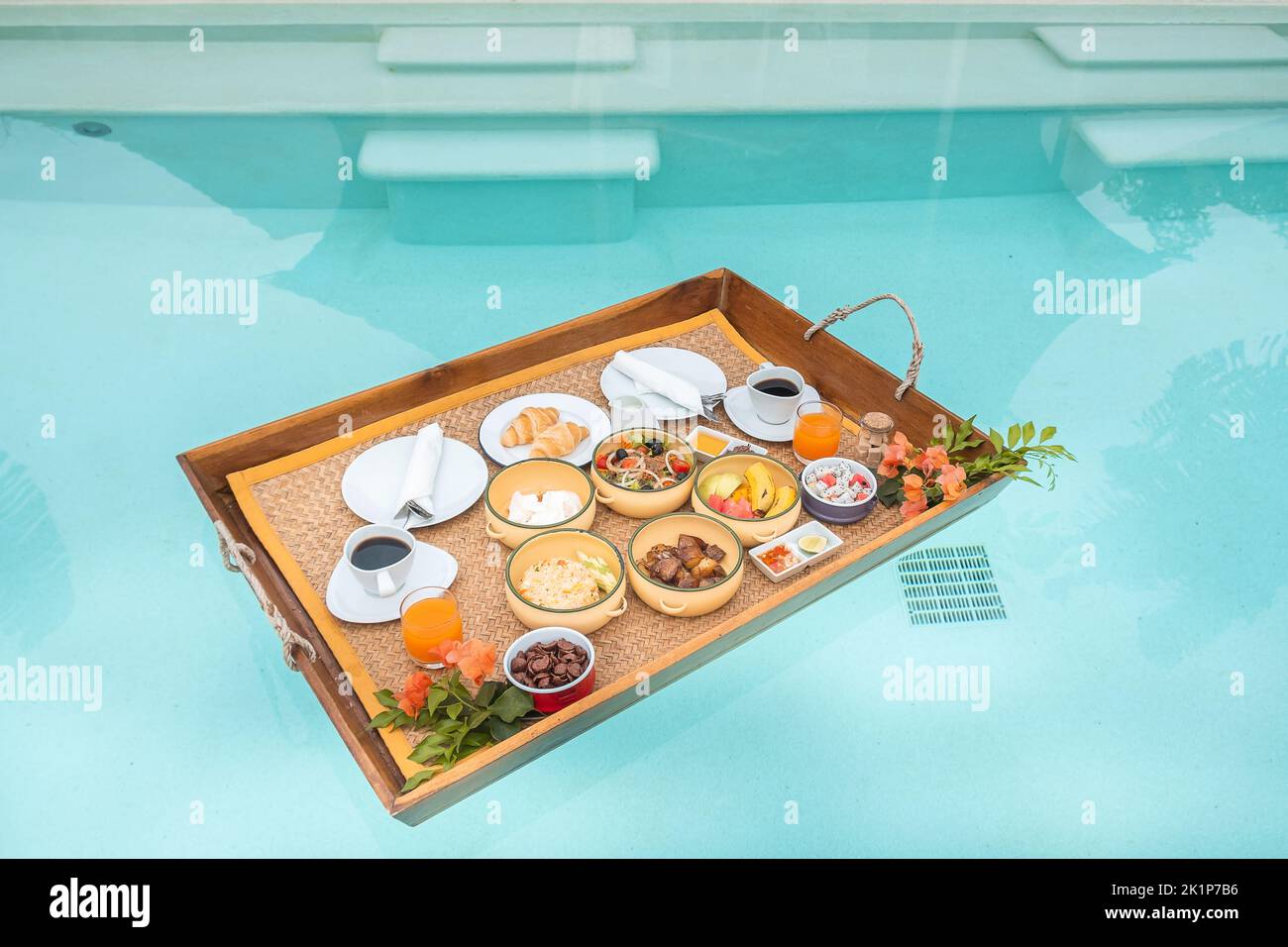 Floating Breakfast tray in swimming pool at luxury hotel or tropical