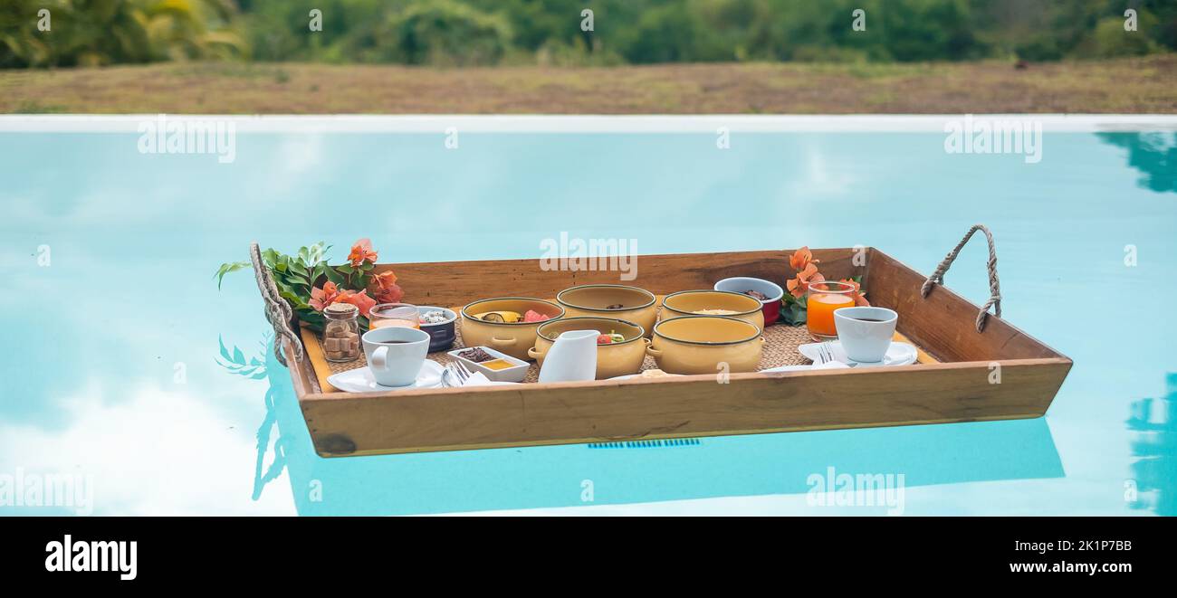 Floating Breakfast tray in swimming pool at luxury hotel or tropical