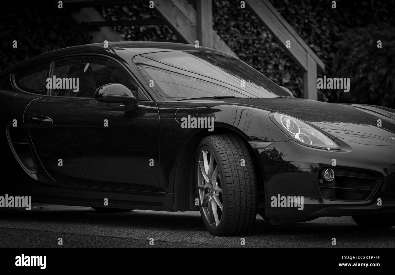 Photograph of a luxury black sportscar Porsche on a street. Street photo, nobody, selective focus, editorial-September 15,2022-Vancouver BC Canada Stock Photo