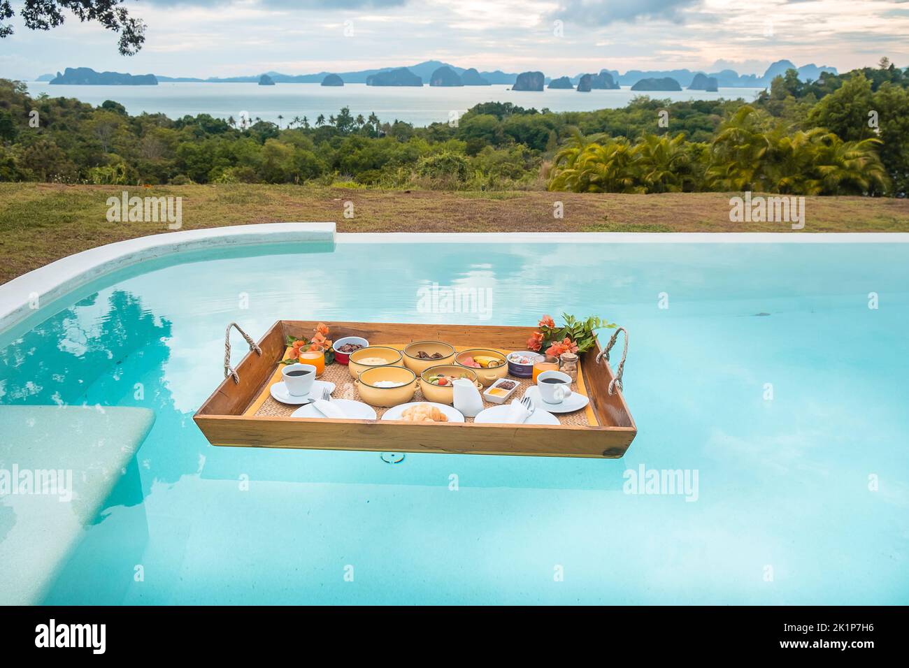Floating Breakfast tray in swimming pool at luxury hotel or tropical