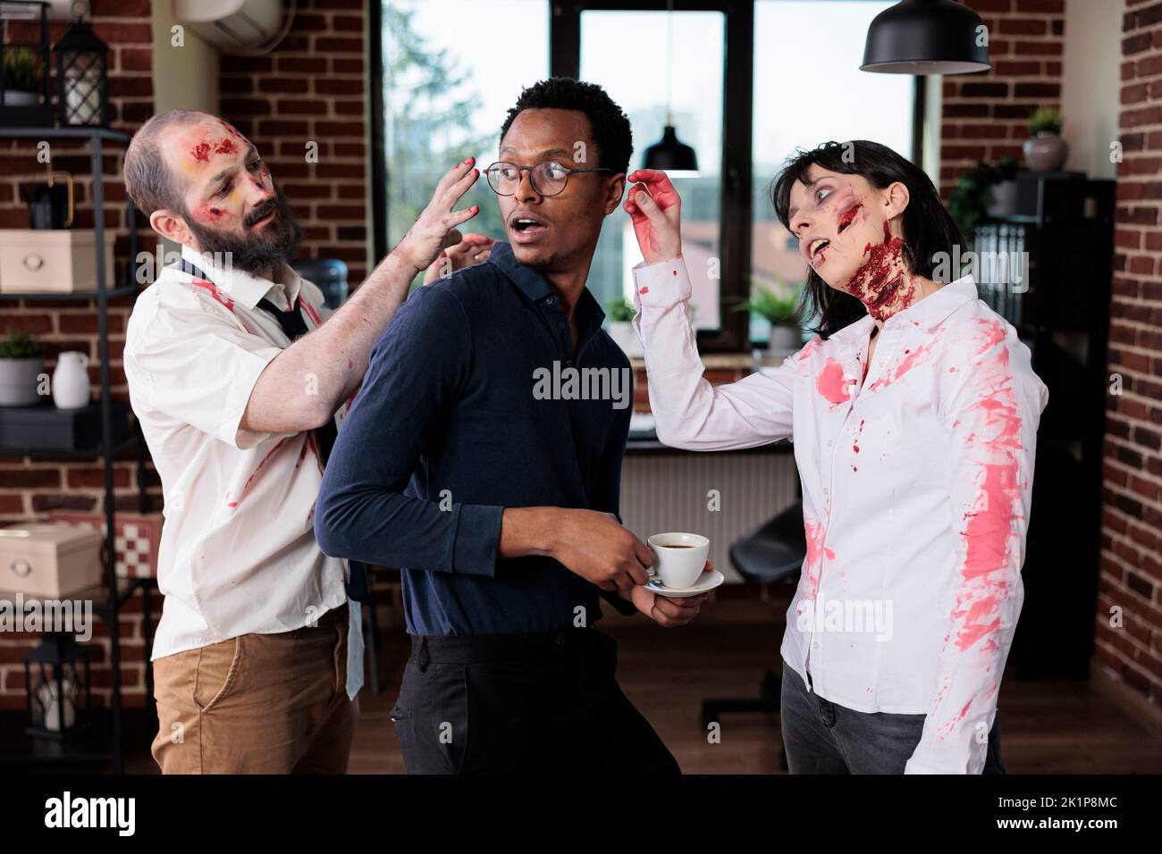 Undead zombies attacking man in office, being scared and afraid about brain eating monsters at work. Aggressive devil corpses chasing frightened businessman, having horrible creepy scars. Stock Photo