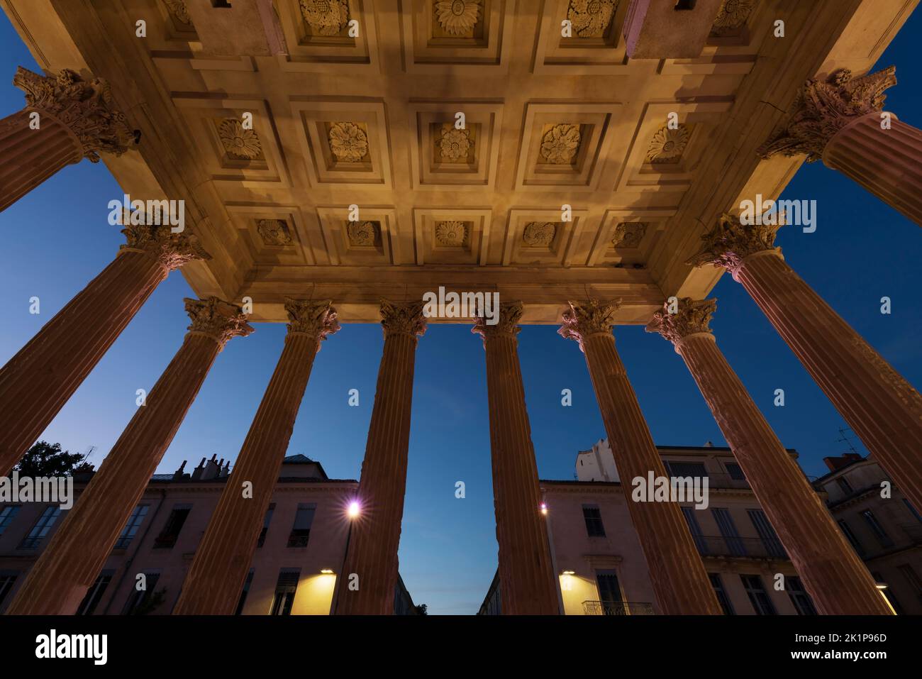 View from Maison Carree by night, raman temple in Nimes, France Stock Photo
