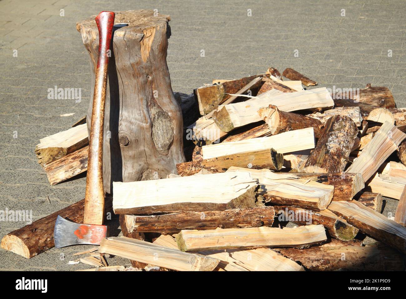 some Split firewood with ax and block Stock Photo