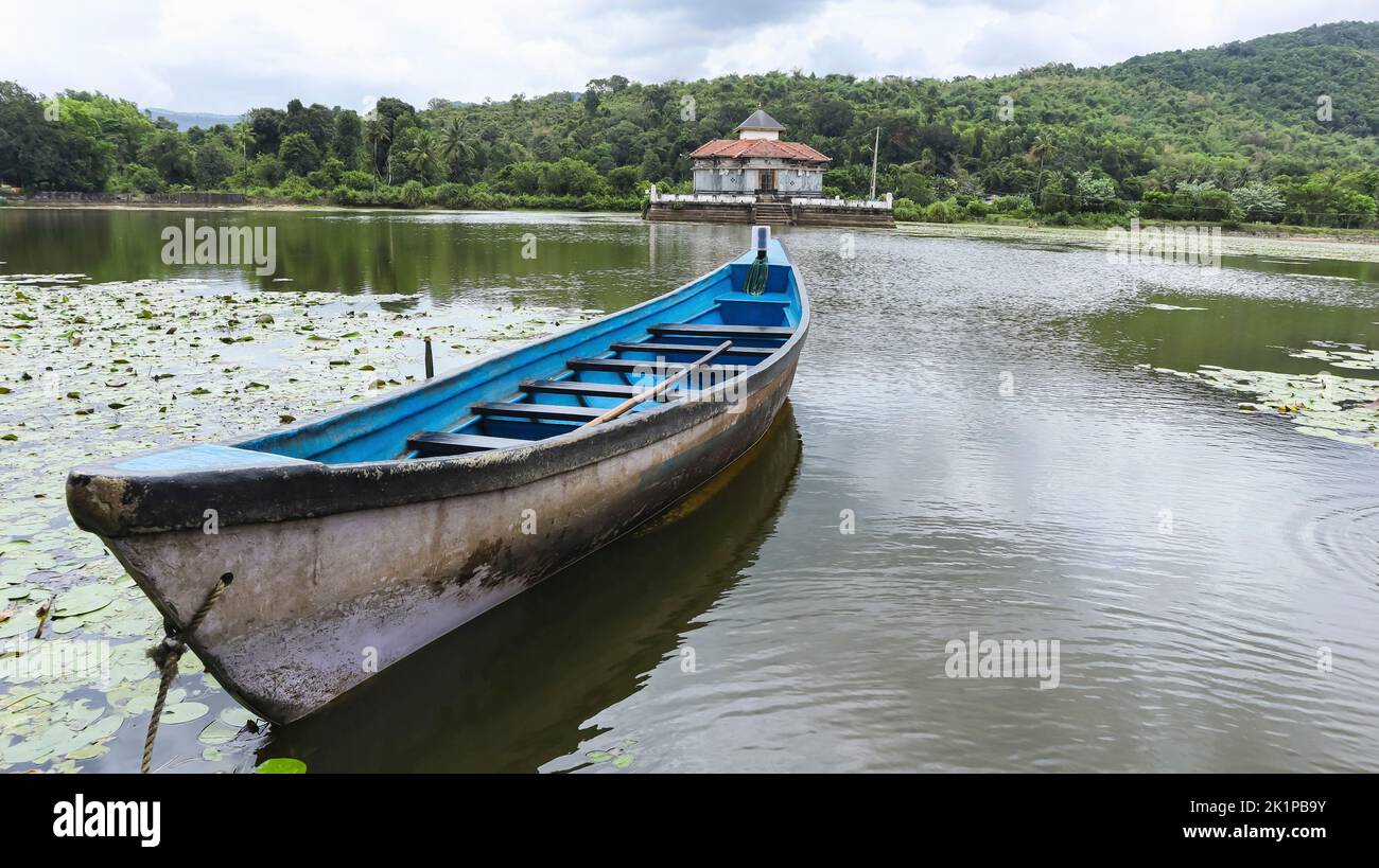 View of Kere Basadi with Small Boat, Varanga, Udupi, Karnataka, India