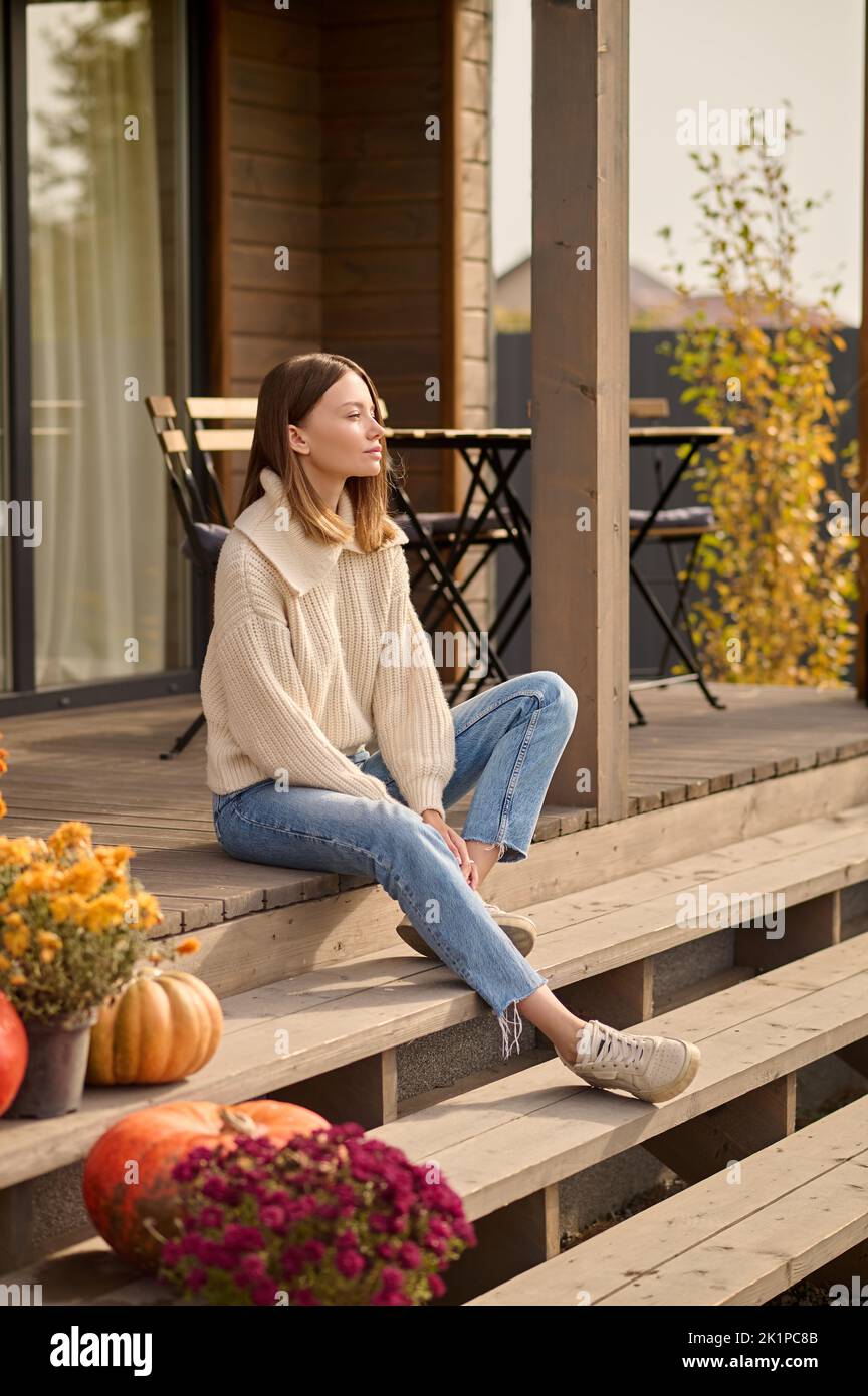 Woman sitting on porch veranda hi-res stock photography and images - Alamy