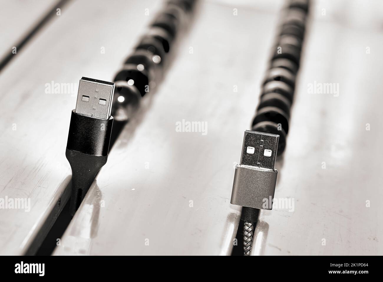 Connect and chat. Black and white usb cables and balloons Stock Photo