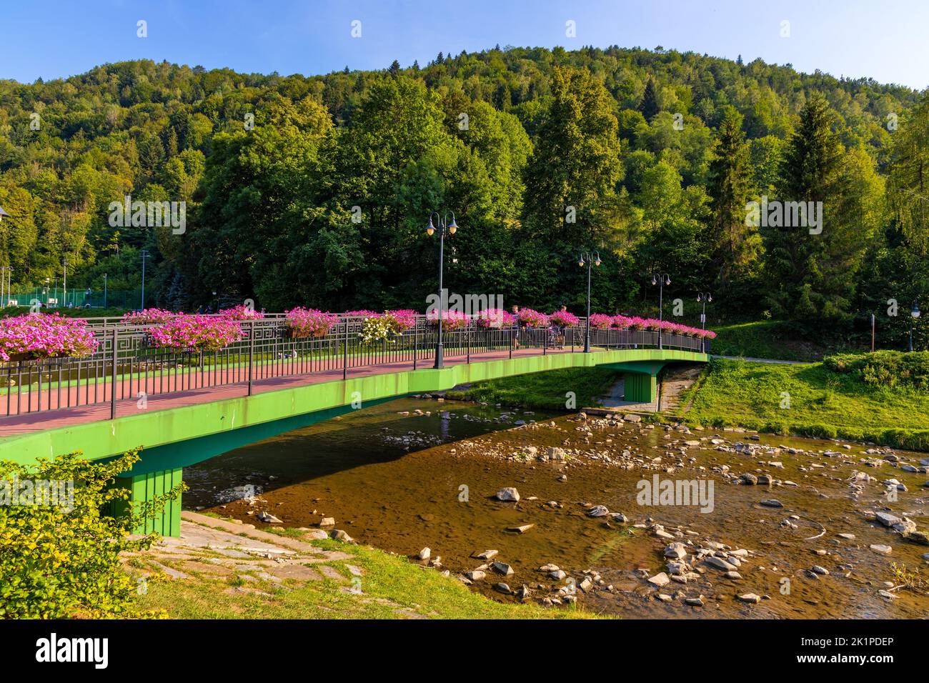 Szczawnica, Poland - August 18, 2022: Most Michala Slowika Dzwona Bridge over Grajcarek creek in Szczawnica Zdroj springs resort in Pieniny Mountains Stock Photo