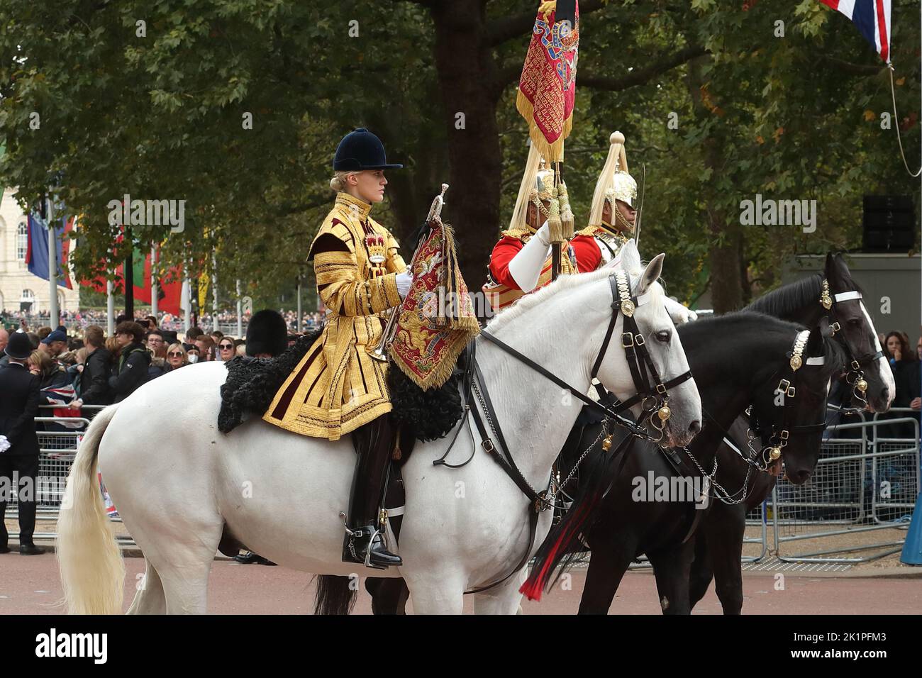 Household Cavalry in their historic colourful uniforms accompany the funeral procession for Queen Elizabeth II on The Mall, London, UK Stock Photo