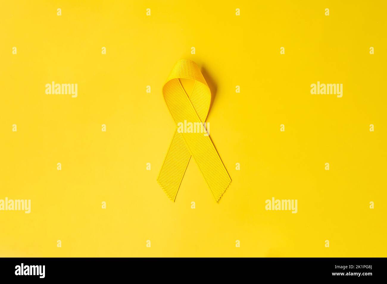 Yellow Ribbon on yellow background for supporting people living and ...