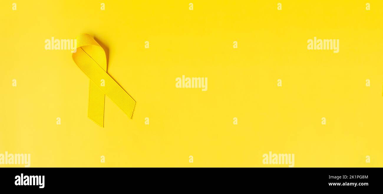 Yellow Ribbon on yellow background for supporting people living and ...